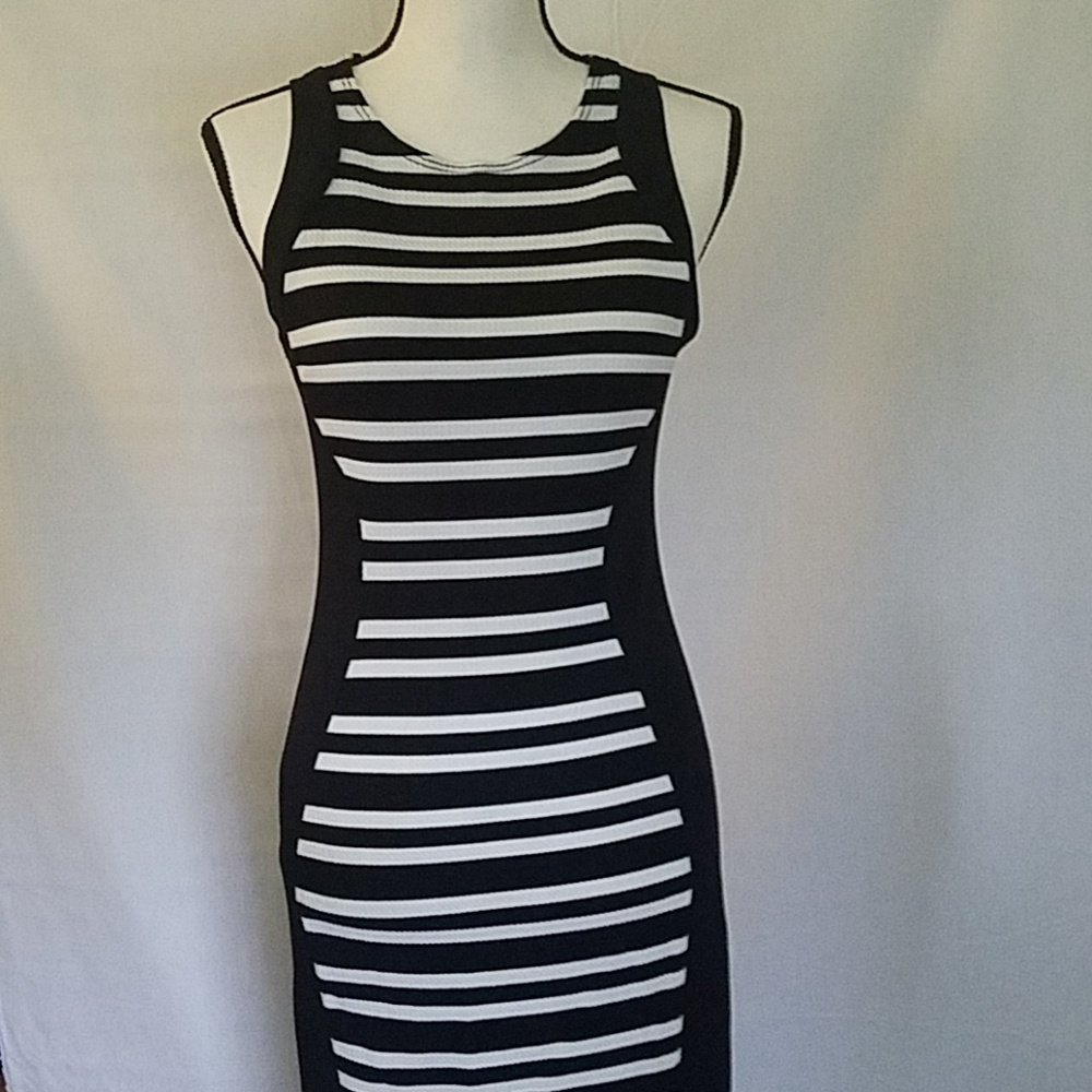 Figure flattering, form fitting racerback dress